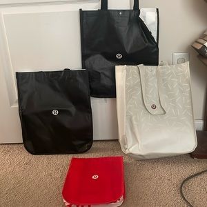 Bundle of 4 Lululemon shopping bags